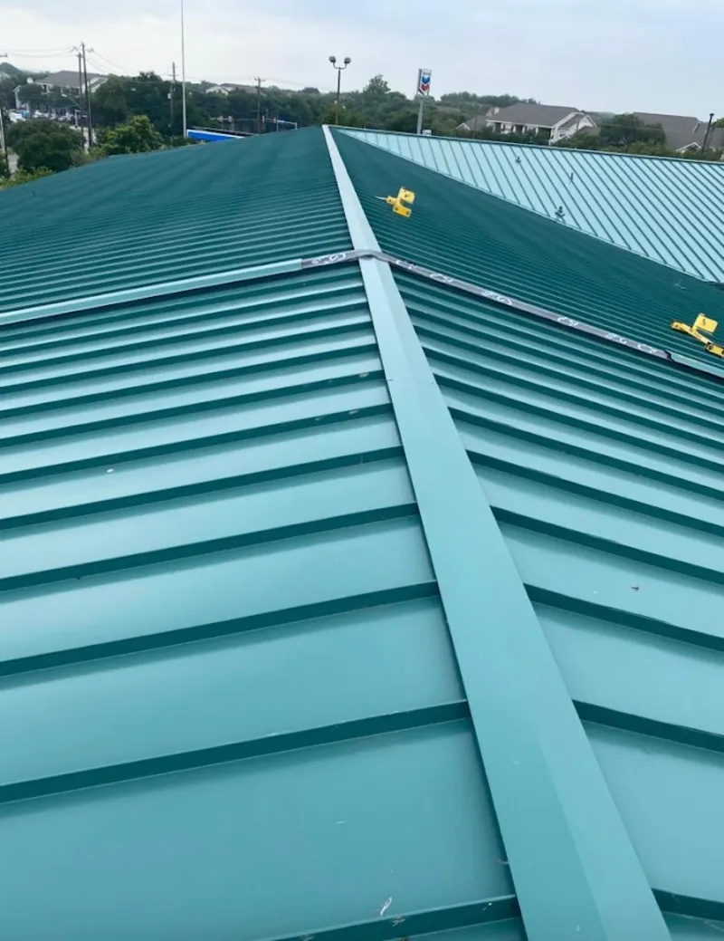 Green commercial metal roof ridge and valley for Metal Roof Repair in Siloam Springs